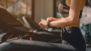 Woman doing a treadmill HIIT workout