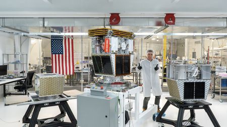 Reflect Orbital co-founder and CEO Ben Nowack with the company's Earendil-1 demonstration satellite, which is slated to launch to Earth orbit sometime in 2026.