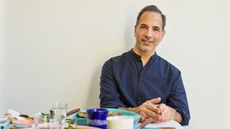 Yotam Ottolenghi on a cream background