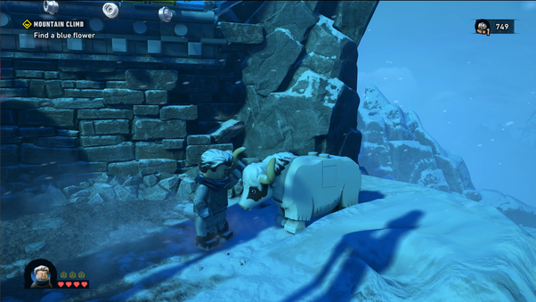 Bruce Wayne pets a Yak on the mountains near the League of Shadows