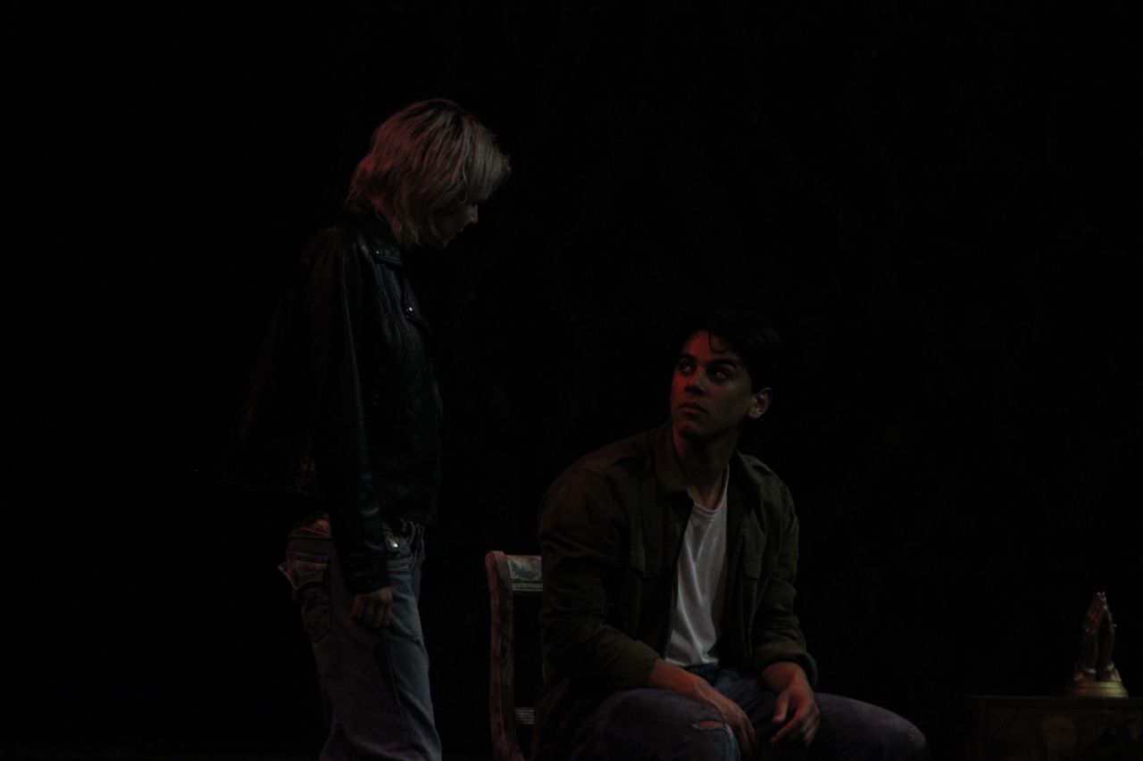 Standing figure in conversation with seated man in Silent Hill 2 stage adaptation Our Special Place