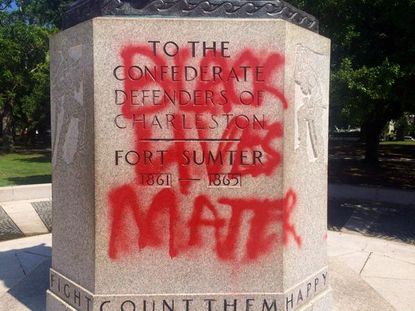 "Black Lives Matter" graffiti on Confederate statue.