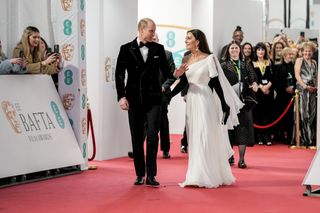 Kate Middleton playfully taps Prince William's bum at the BAFTAs