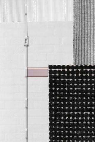 A utilitarian identity juxtaposed with Kvadrat's drooping, softer fabrics