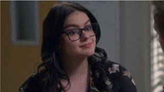 Ariel Winter in Modern Family wearing glasses and a floral shirt. 