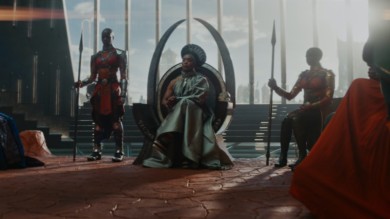 Angela Bassett's Ramonda sitting in Wakandan throne room in Black Panther: Wakanda Forever