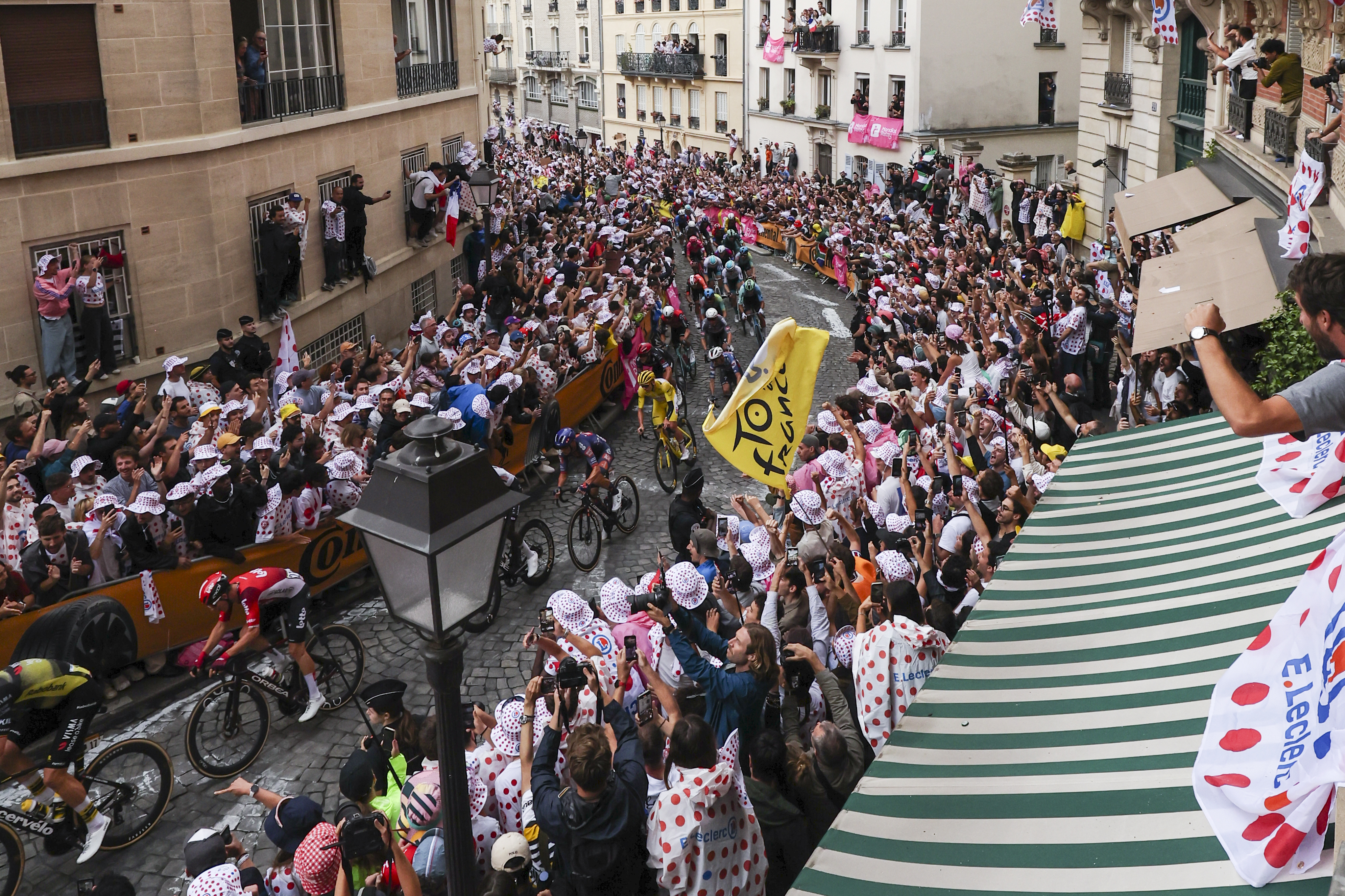 The Tour de France peloton rides through Montmartre