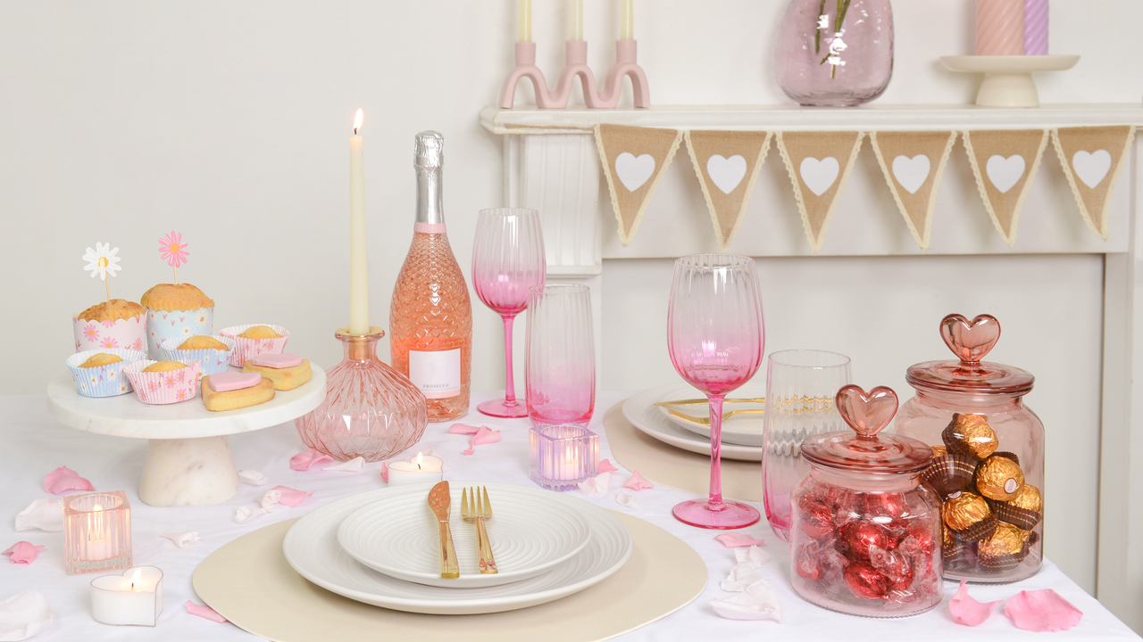 Table set up for a tea party using pink decor.