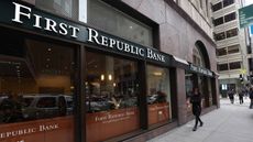 Person walking in front of First Republic Bank headquarters in San Francisco