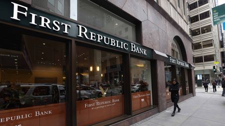 Person walking in front of First Republic Bank headquarters in San Francisco