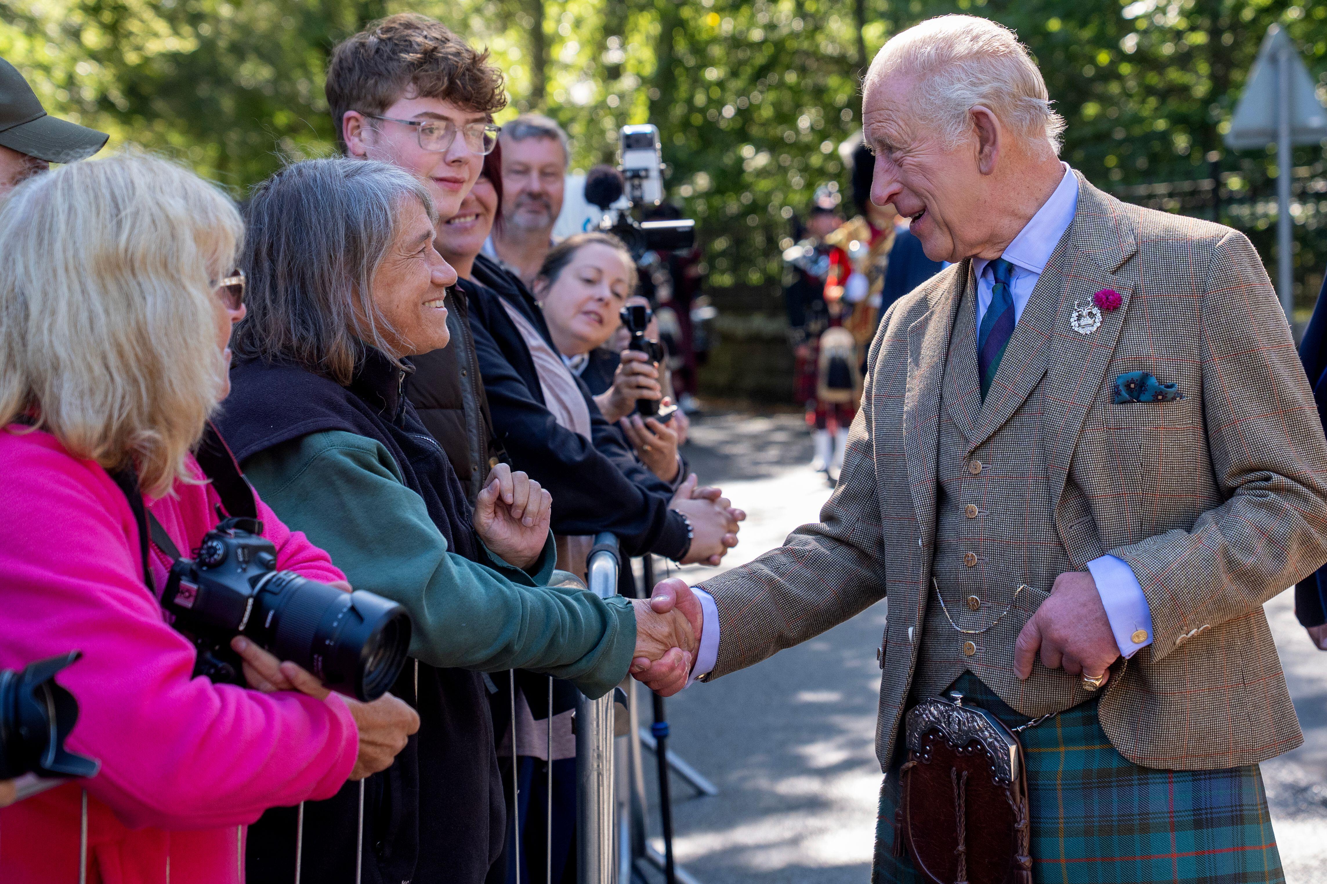 King Charles shaking hands with a fan at Balmoral