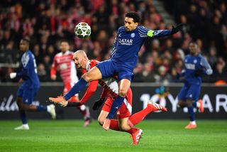 Marquinhos of Paris Saint-Germain is challenged by Ludovic Ajorque of Stade Brestois 29 during the UEFA Champions League 2024/25 League Knockout Play-off first leg match between Stade Brestois 29 and Paris Saint-Germain at Stade de Roudourou on February 11, 2025 in Guingamp, France.