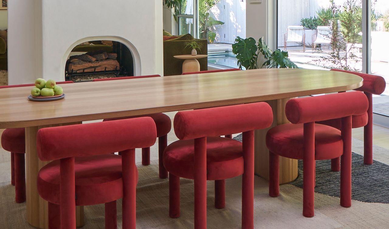 a dining room with red chairs