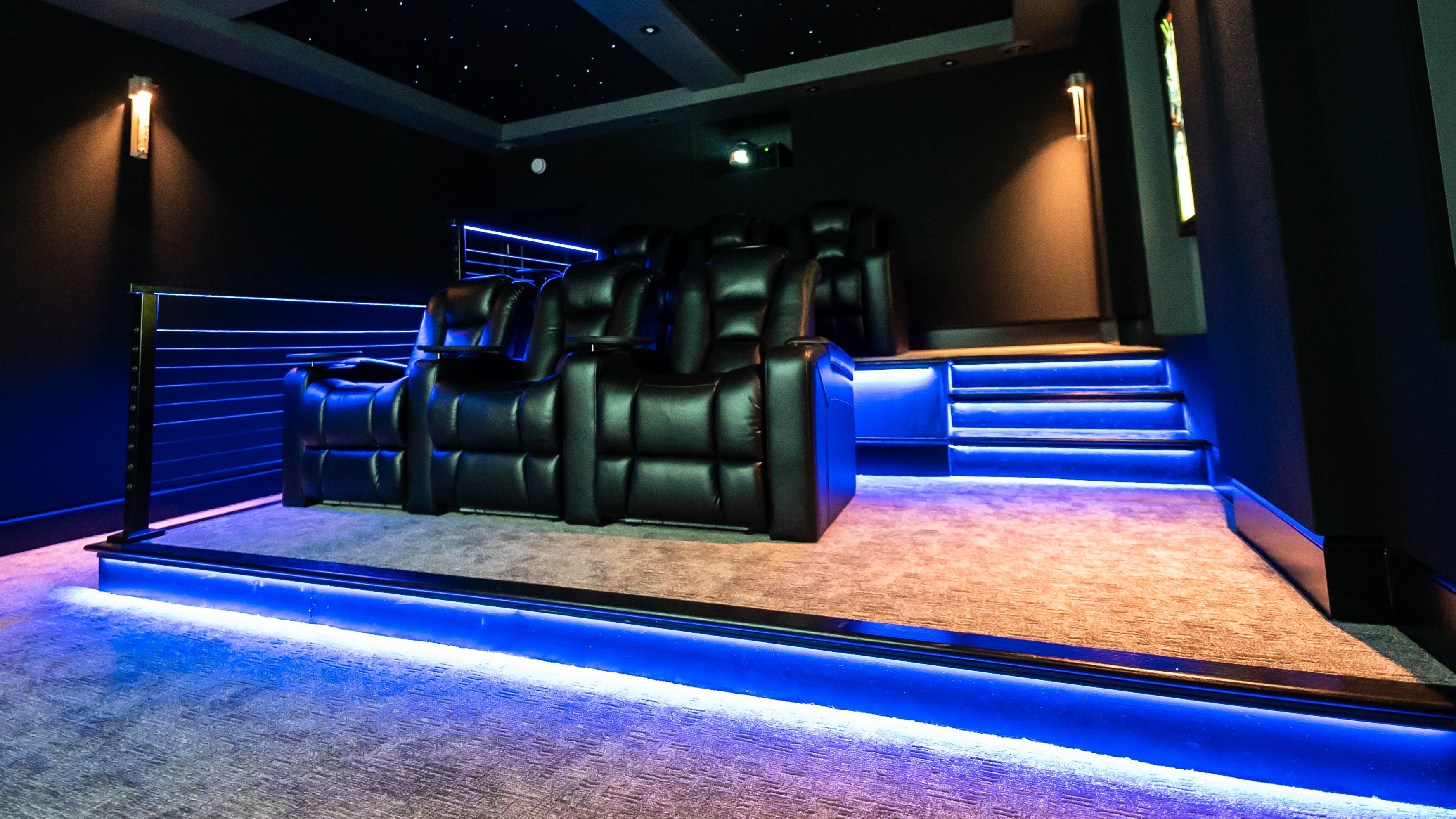 Basement Buildout Magic home theater showing seats, lighting and screen