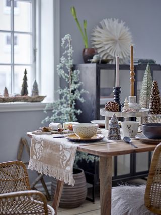 Christmas table with burlap runner, trees and candles