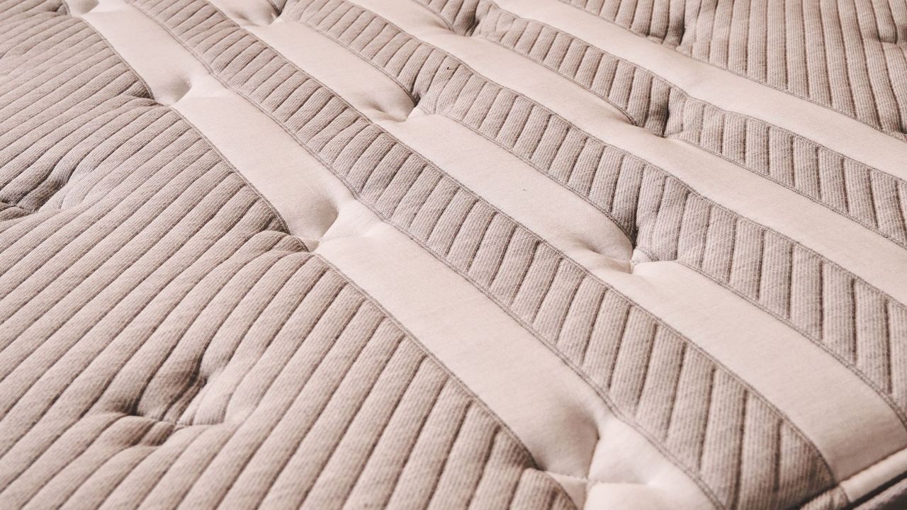 A close-up look at the Leesa Studio Chill's stylish striped cover design