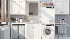 white laundry room with washing machine, dryer and laundry baskets