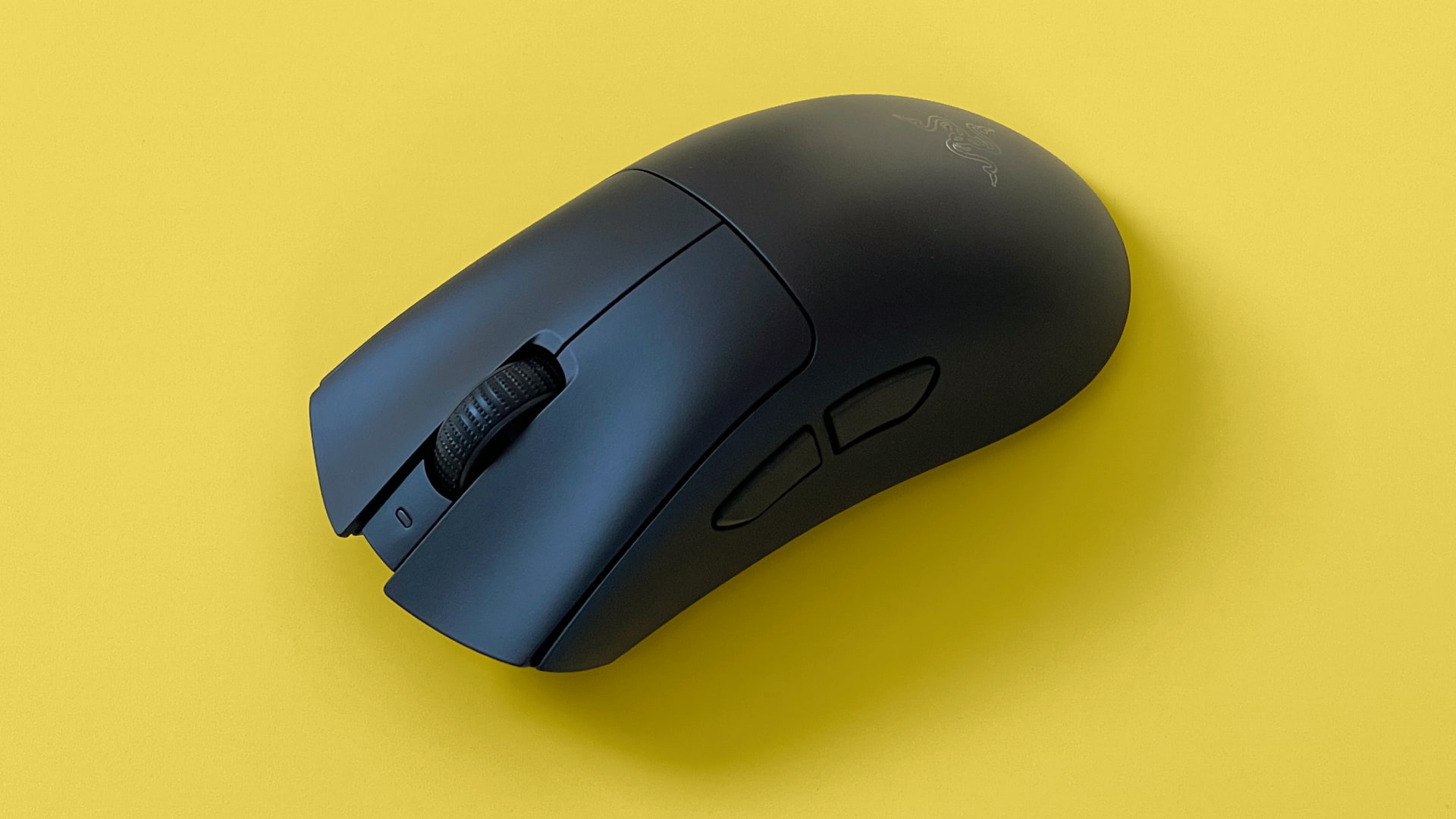 A Razer DeathAdder V3 HyperSpeed mouse against a yellow background.