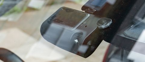 The Thinkware T700 dash cam mounted inside a car's windscreen