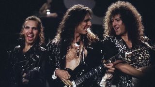 L-R Joe Satriani, Steve Vai and Brian May performing on stage at Guitar Legends Expo, October 1, 1991
