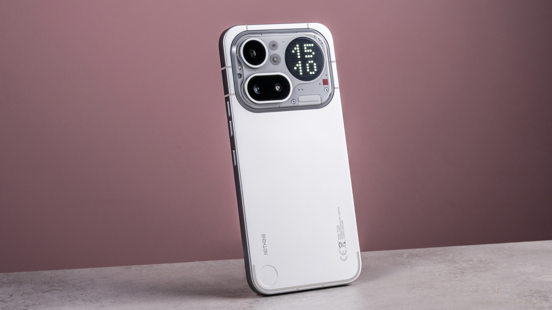 The Nothing Phone (4a) Pro's back showing its aluminum unibody, camera module and Glyph Matrix, which features a digital clock reading '15:10'.