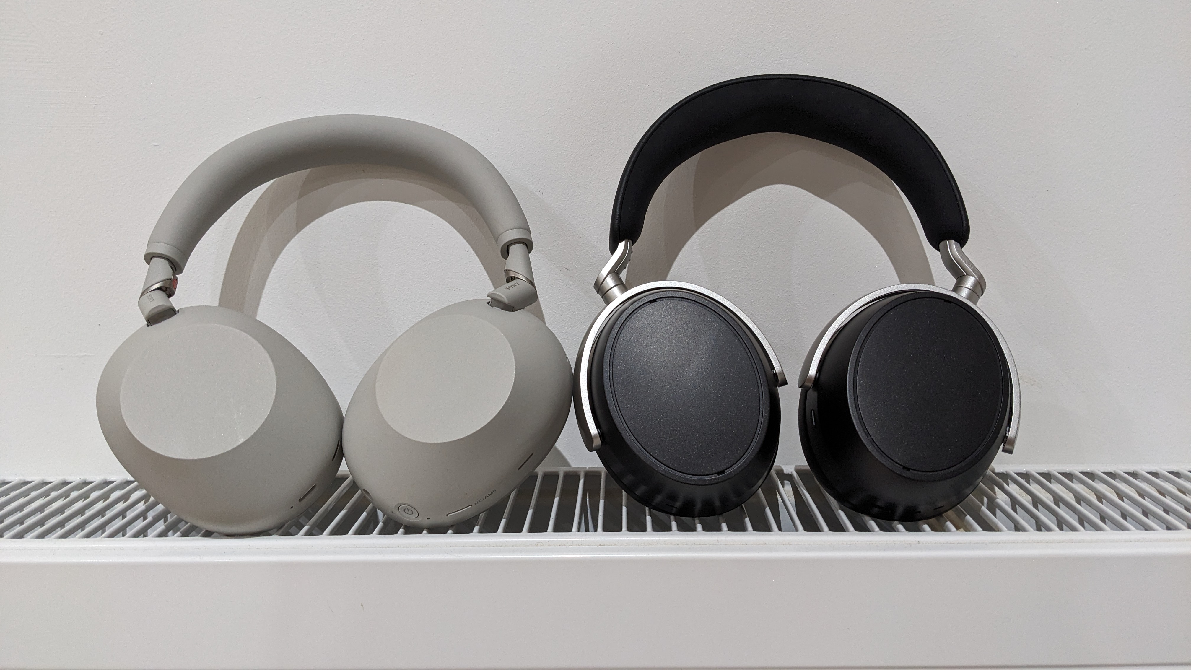 Sennheiser HDB 630 and Sony XM6 against a white background