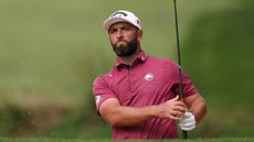 Jon Rahm holds his finish on a wedge shot