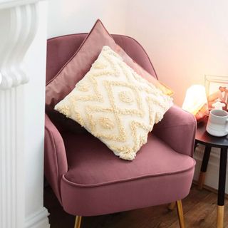 sass & belle sand tufted diamond cushion on a mauve arm chair