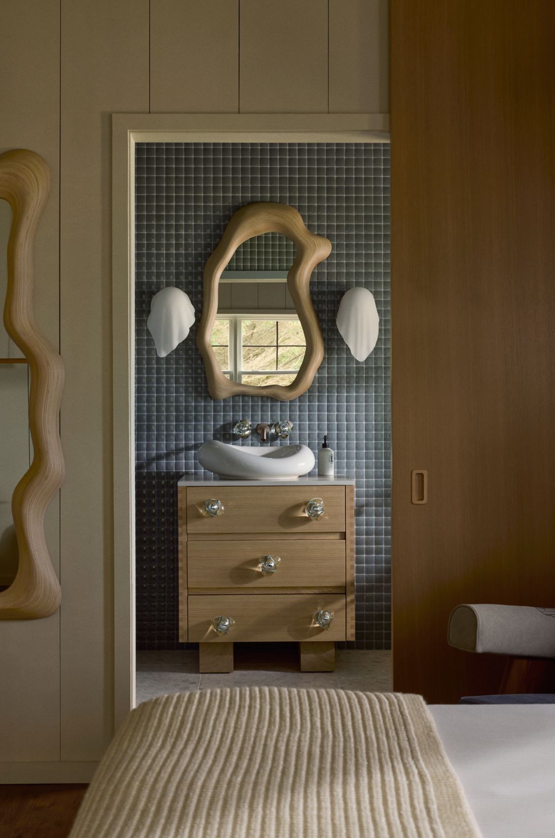 A whimsically conceived modern cabin with playful interiors in neutral hues.