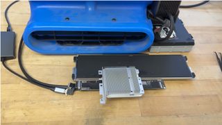 A MacBook Neo mod that uses an industrial air blower to cool it.