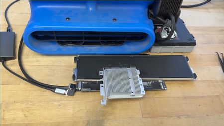 A MacBook Neo mod that uses an industrial air blower to cool it.