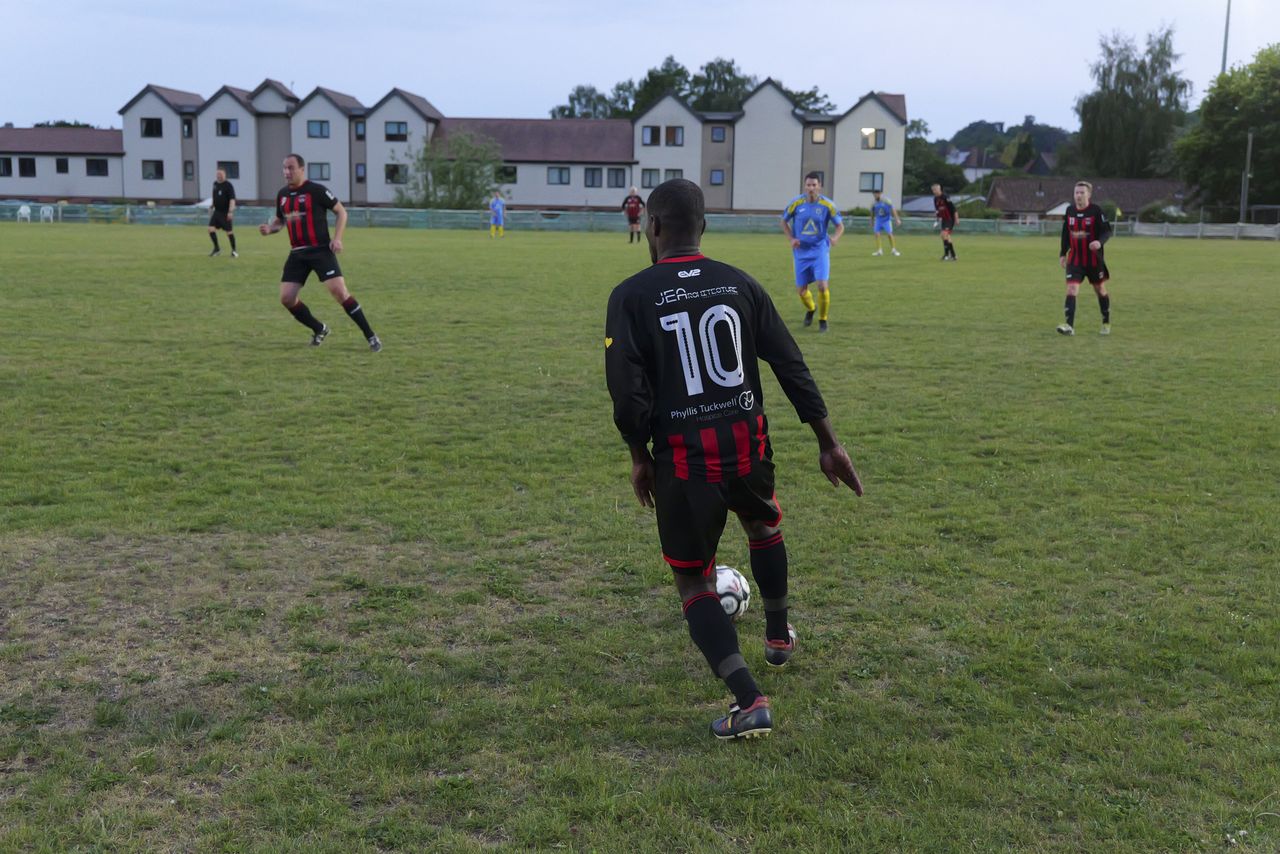 Panasonic Lumix S1 II sample gallery: footballers in action during game at last light