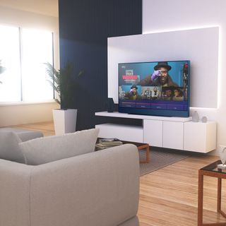 living room with wooden flooring grey sofa and television