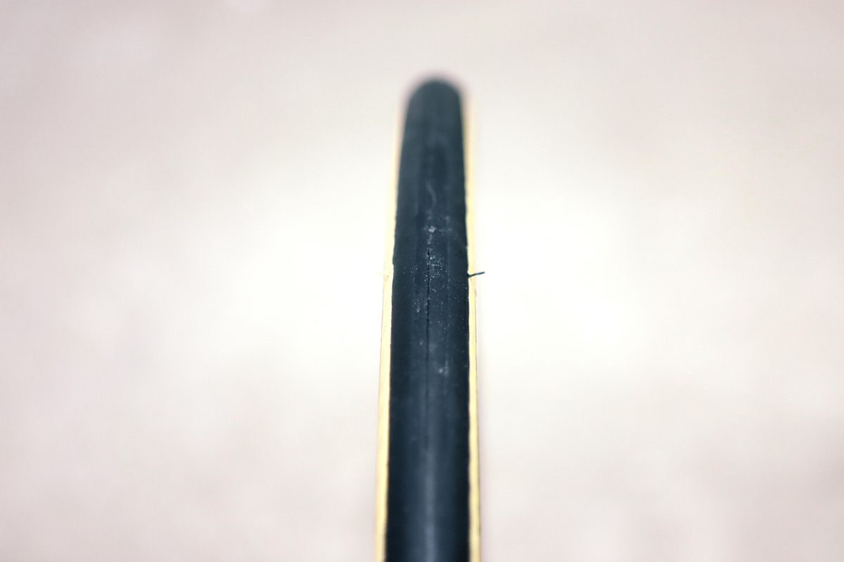 A tan bicycle tyre on a white background