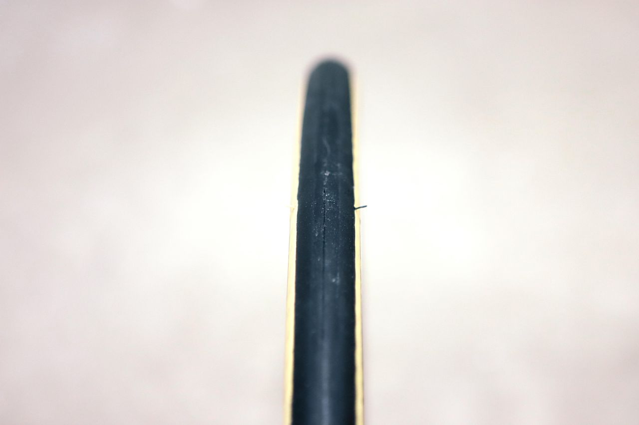A tan bicycle tyre on a white background