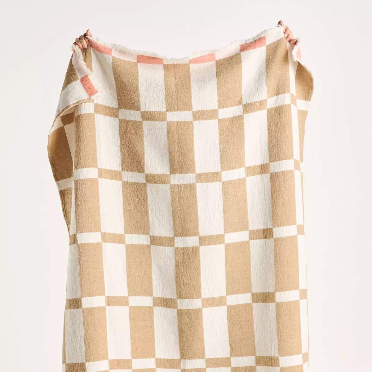 A large beige and white blanket