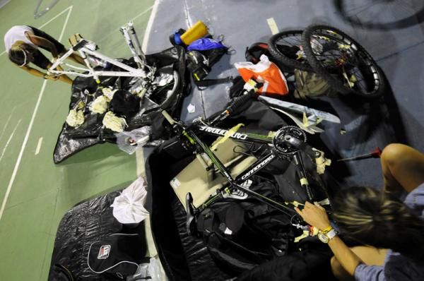 Racers unpack their bikes on the eve of the start
