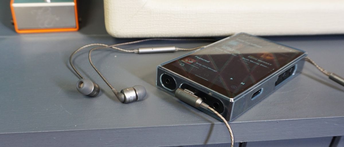 SoundMagic E80D inserted into FiiO M11S music player