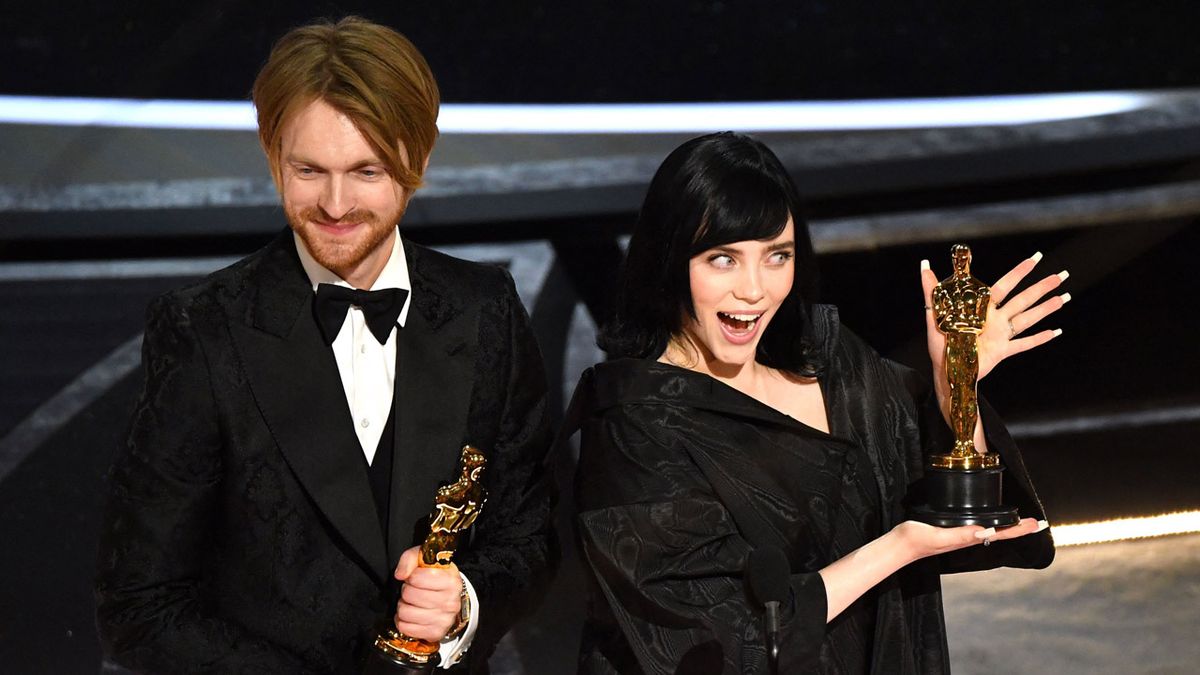 US singer-songwriter Finneas O&#039;Connell (L) and US singer-songwriter Billie Eilish accept the award for Best Music (Original Song) for &quot;No Time to Die&quot; onstage during the 94th Oscars at the Dolby Theatre in Hollywood, California on March 27, 2022