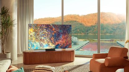 Samsung Neo QLED Mini-LED TV in a bright living room with a lake out the window