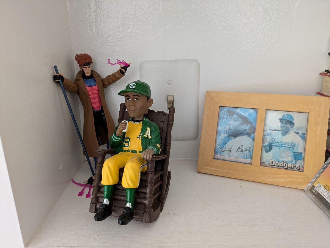 shot of gambit figurine behind Satchel Paige bobblehead shot by Pixel 8a