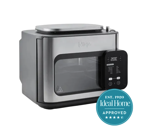 A large silver Ninja oven with a black control panel and a blue Ideal Home 4.5 stars approved badge in the right hand corner.