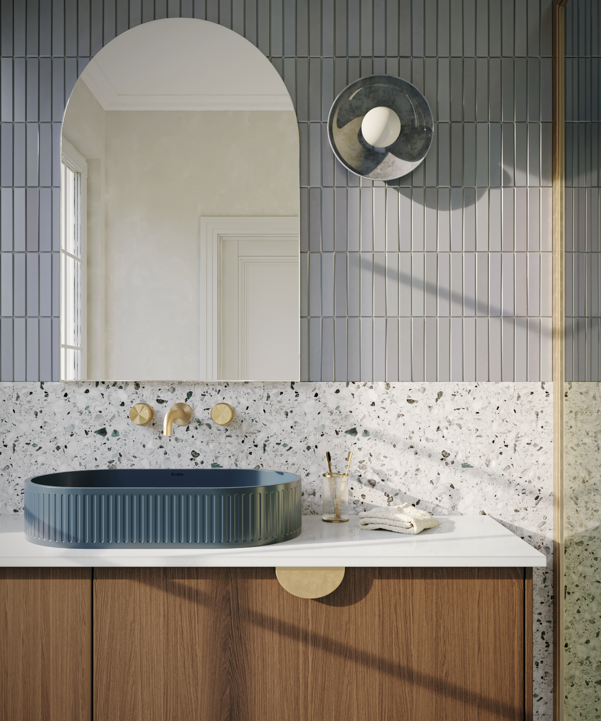 Blue basin on a wooden and white cabinet with an arched mirror above