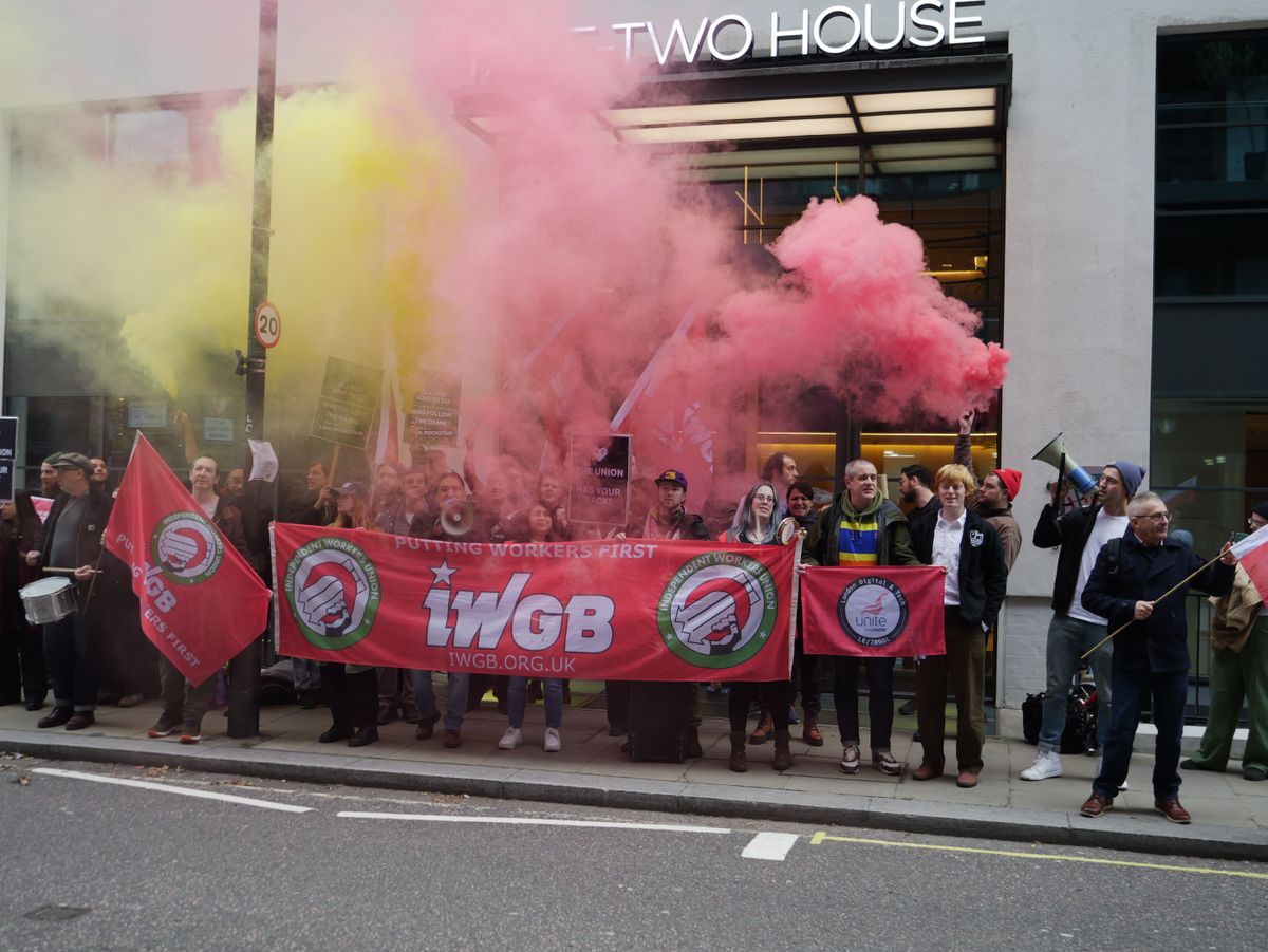 Protestors and smoke outside Take-Two's office.