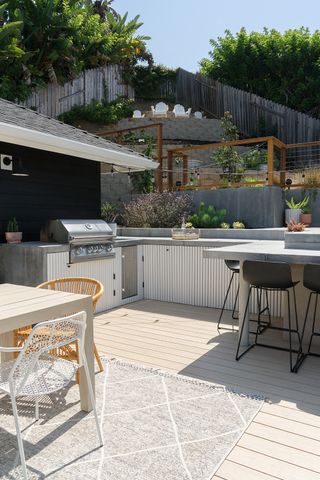 outdoor kitchen in poured concrete finish with a fluted finish