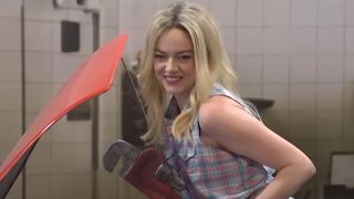 Screenshot of Emma Stone as sexy mechanic poster girl in Saturday Night Live sketch