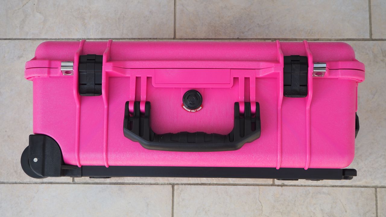 Peli / Pelican 1510 protector case in bright pink on a flagstone floor