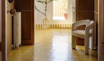 a tiled hallway with timber paneling