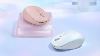 Two examples of the Asus Fragrance Mouse sitting on a table