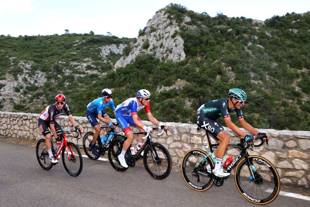 NMES FRANCE JULY 08 Harry Sweeny of Australia and Team Lotto Soudal Imanol Erviti of Spain and Movistar Team Stefan Kng of Switzerland and Team Groupama FDJ Nils Politt of Germany and Team BORA Hansgrohe in breakaway during the 108th Tour de France 2021 Stage 12 a 1594km stage from SaintPaulTroisChateaux to Nimes LeTour TDF2021 on July 08 2021 in Nmes France Photo by Michael SteeleGetty Images